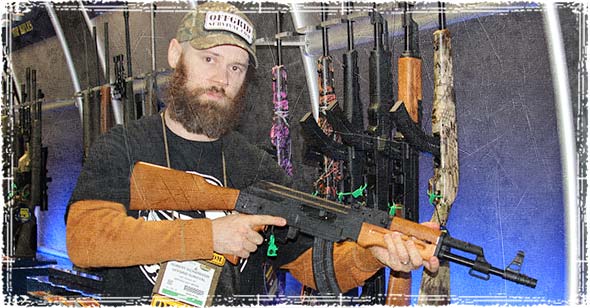 Holding a AK47 style rifle