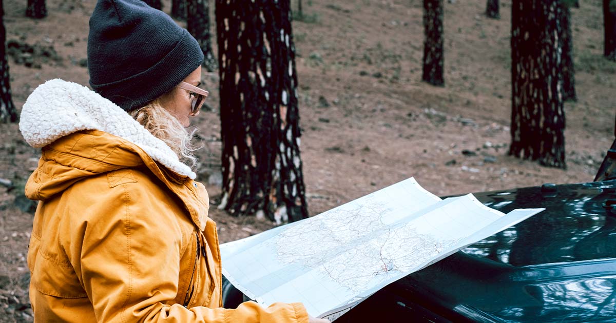 Mom using a map to route out a bugout route