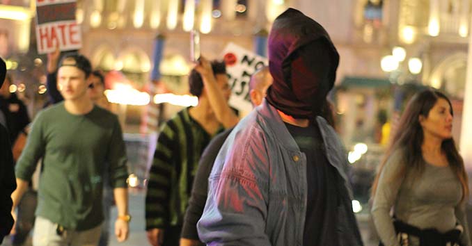 Activists in masks trying to start a riot