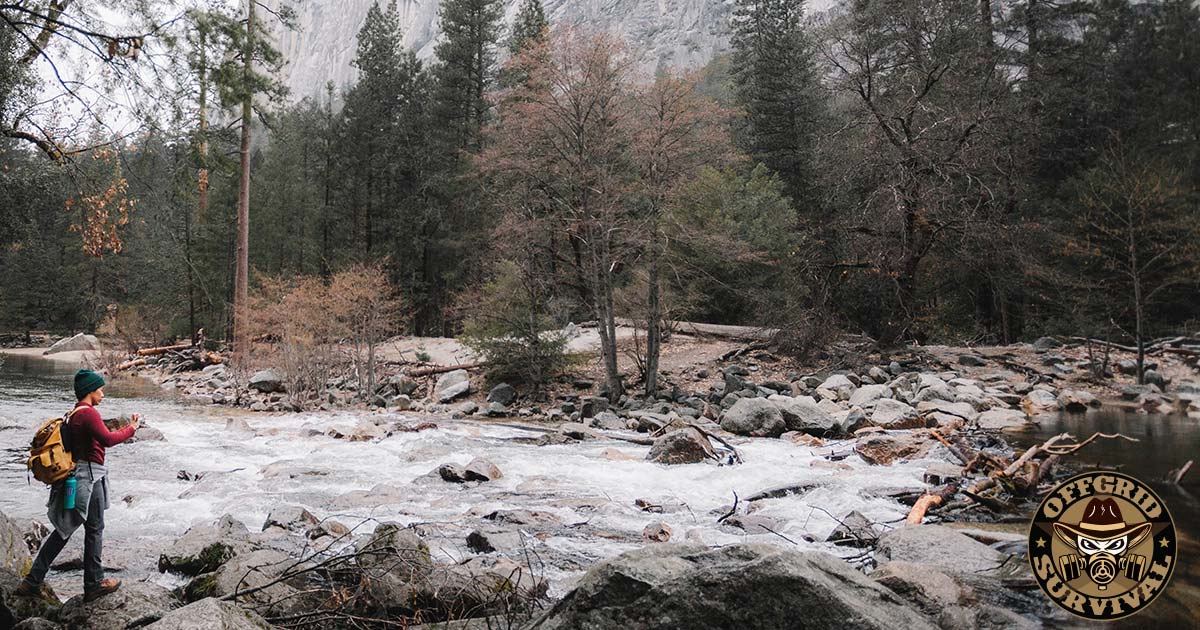 Hiking near a raging river in the backcountry 