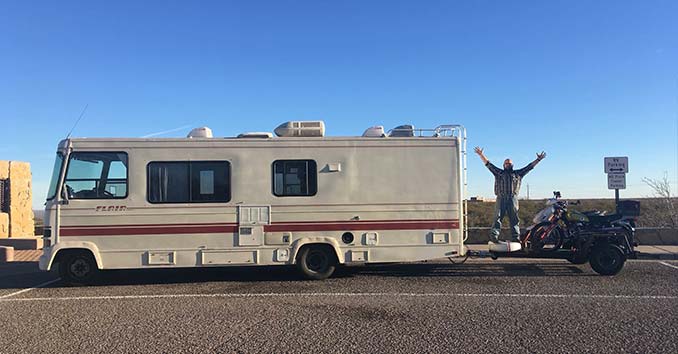 An RV towing Motorcycles