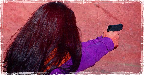 Woman holding a handgun